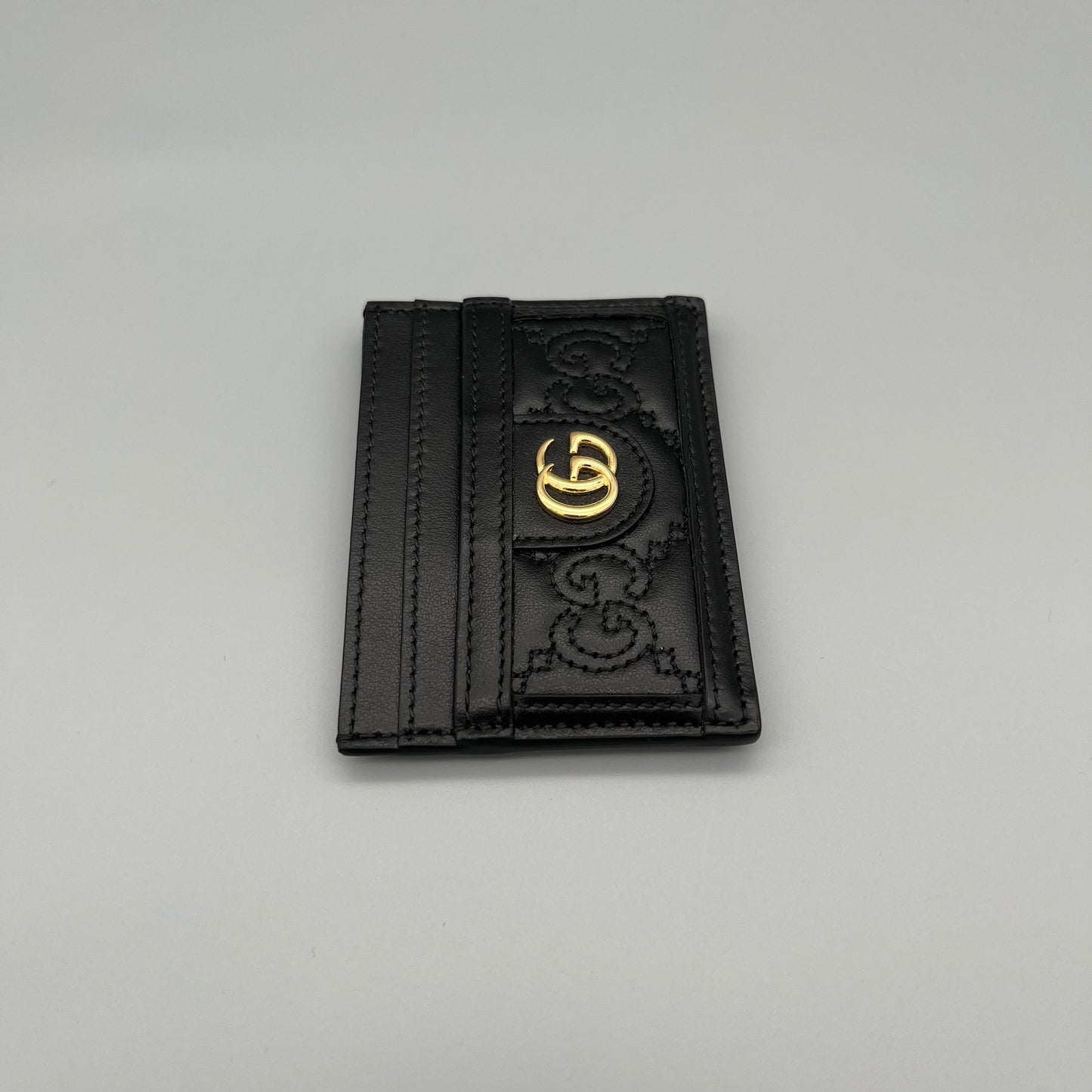 Gucci Kartenetui aus schwarzem Leder mit GG-Logo - elegantes Designer-Accessoire für Karten und Bargeld.