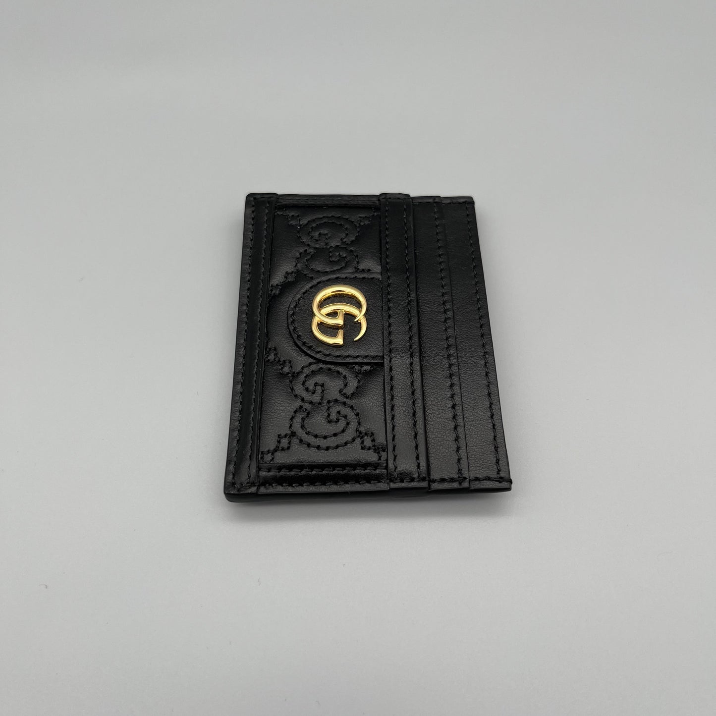 Gucci Kartenetui aus schwarzem Leder mit GG-Logo - elegantes Designer-Accessoire für Karten und Bargeld.
